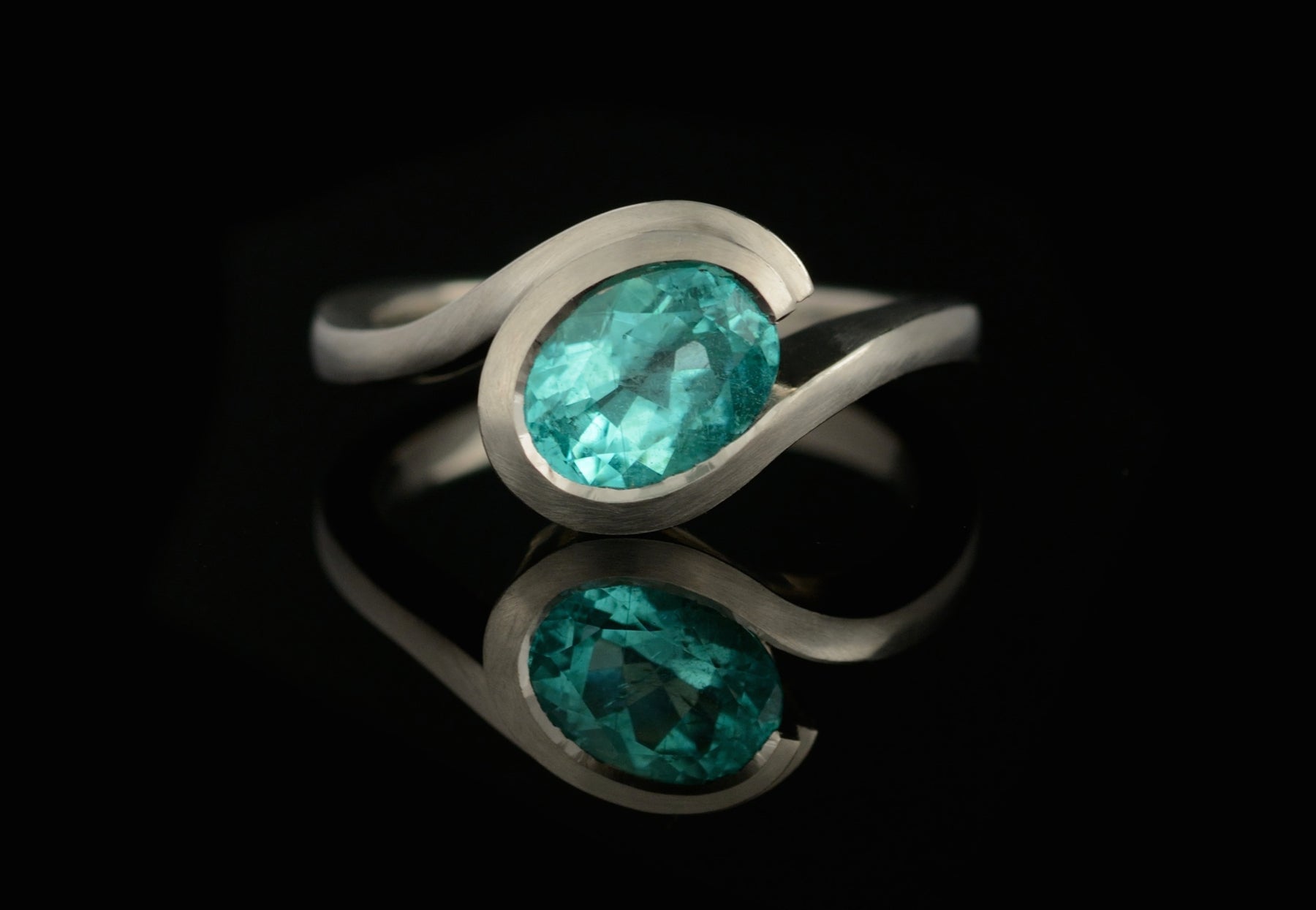 Paraiba tourmaline and platinum Wave engagement ring