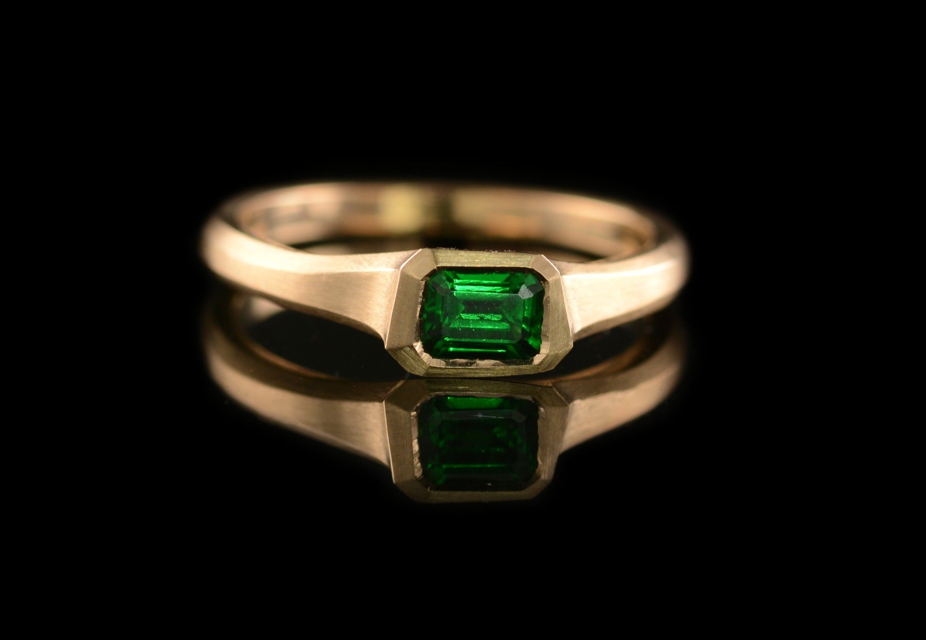 Carved tsavorite garnet rose gold engagement ring