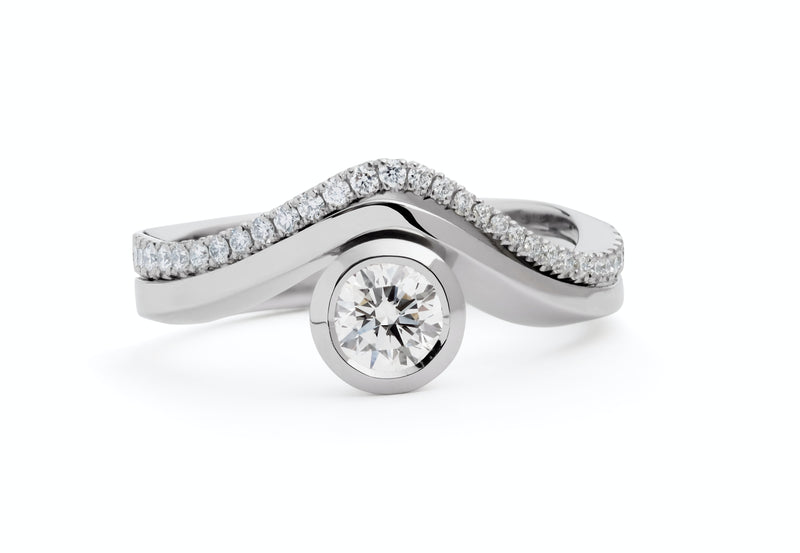 Balance' platinum engagement ring with matching wedding band